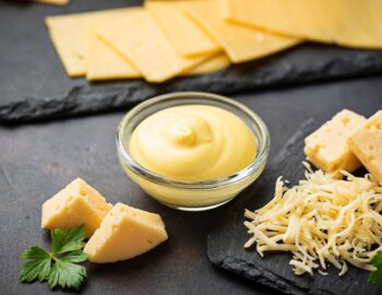 Homemade cheese sauce in glass bowl